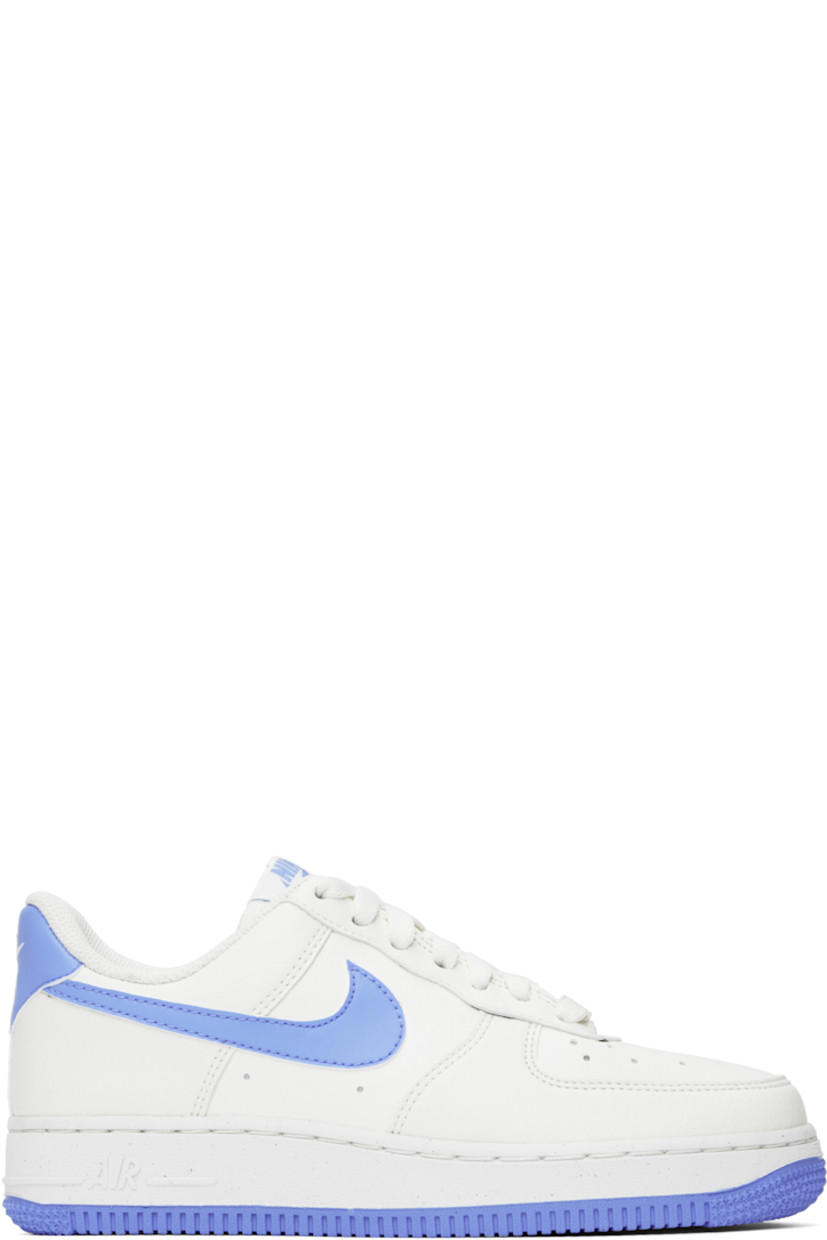 Low-top grained faux-leather sneakers in white and blue.

· Perforated detailing at toe and sides
· Logo plaque at lace-up closure
· Logo patch at padded tongue
· Padded collar
· Swoosh appliqué at sides
· Logo embroidered at heel tab
· Mesh lining
· Nike Air cushioning at foam rubber midsole
· Treaded rubber sole

Please note that this item may be shipped only within North America.

Supplier color: Sail/Royal pulse