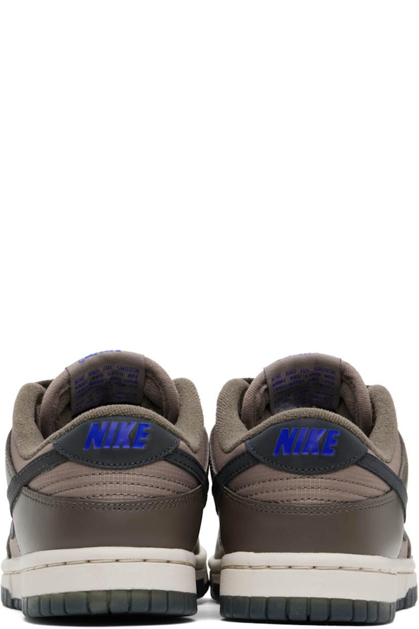 Low-top buffed leather and ripstop sneakers in brown.

· Lace-up closure
· Logo patch at padded tongue
· Padded collar
· Swoosh appliqué at sides
· Logo printed at heel tab
· Terrycloth lining
· Treaded rubber sole

Please note that this item may be shipped only within North America.

Supplier color:  Ironstone/Mink brown/Racer blue/Anthracite