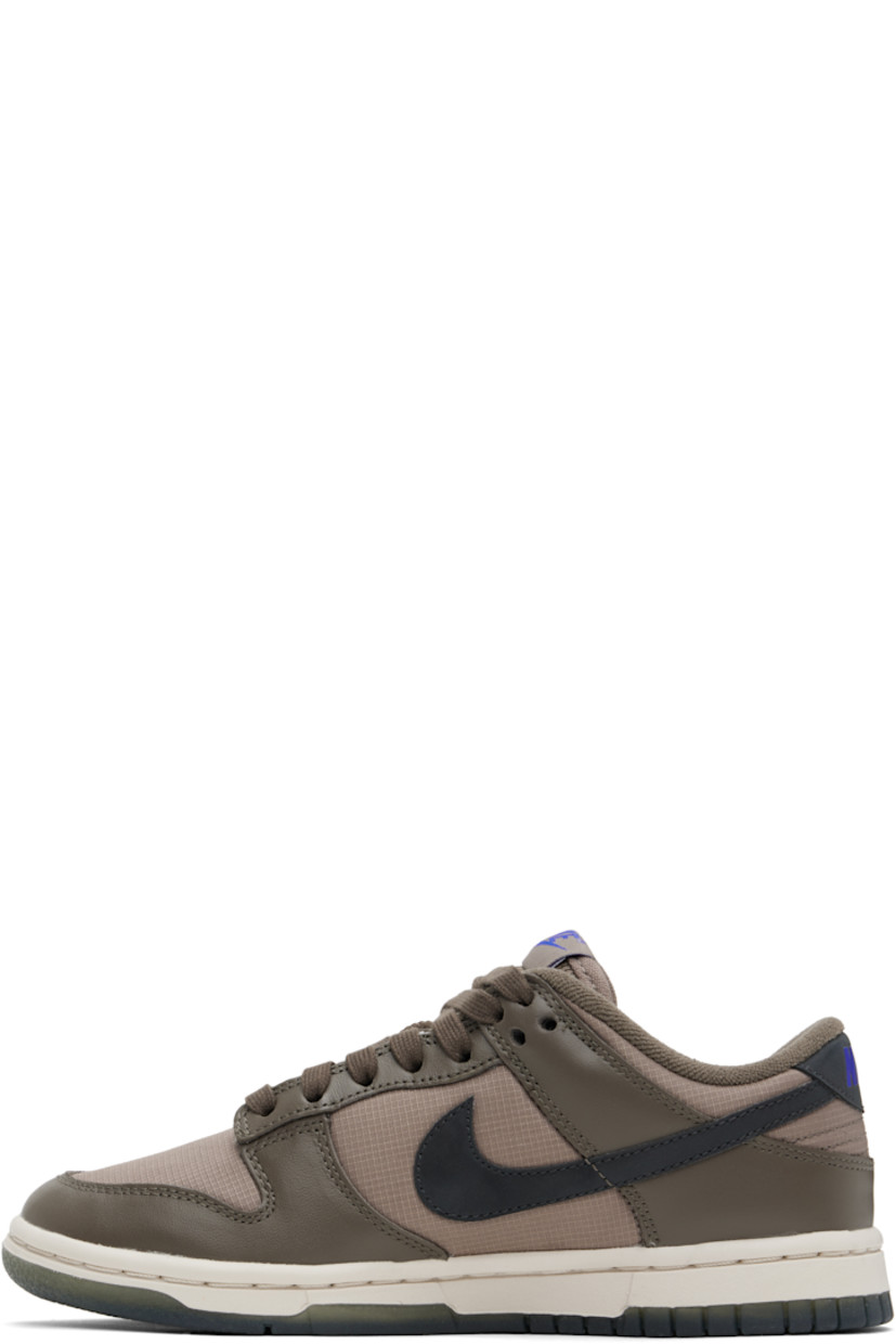 Low-top buffed leather and ripstop sneakers in brown.

· Lace-up closure
· Logo patch at padded tongue
· Padded collar
· Swoosh appliqué at sides
· Logo printed at heel tab
· Terrycloth lining
· Treaded rubber sole

Please note that this item may be shipped only within North America.

Supplier color:  Ironstone/Mink brown/Racer blue/Anthracite