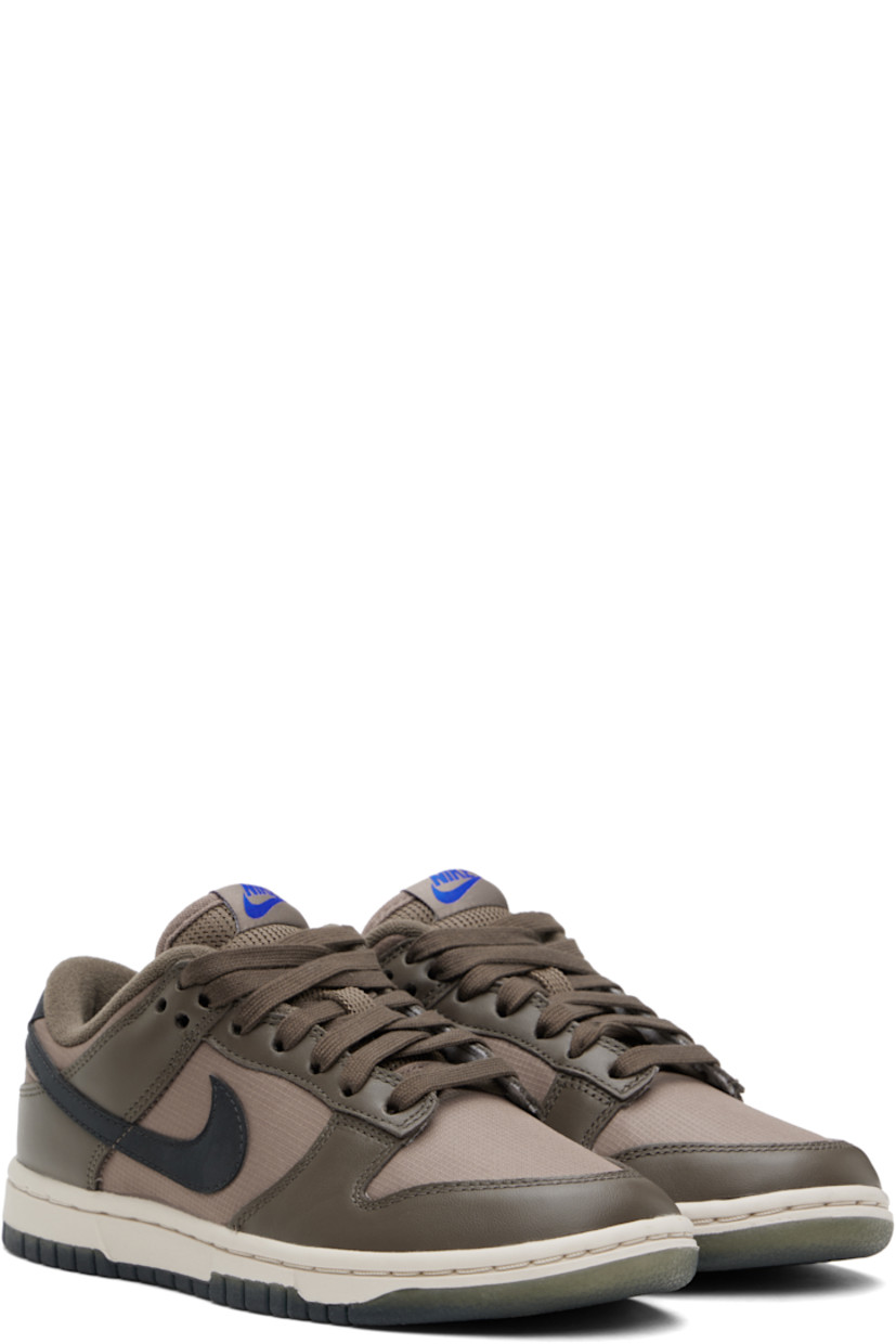 Low-top buffed leather and ripstop sneakers in brown.

· Lace-up closure
· Logo patch at padded tongue
· Padded collar
· Swoosh appliqué at sides
· Logo printed at heel tab
· Terrycloth lining
· Treaded rubber sole

Please note that this item may be shipped only within North America.

Supplier color:  Ironstone/Mink brown/Racer blue/Anthracite