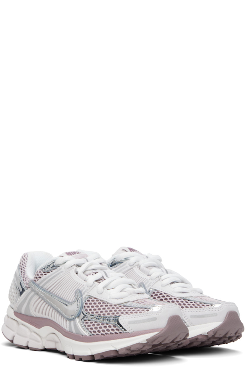Low-top mesh, buffed leather, and faux-leather sneakers in white and silver tone.

· Reflective trim throughout
· Lace-up closure
· Logo patch at padded tongue
· Padded collar
· Swoosh appliqué and mesh overlay at sides
· Swoosh printed at heel tab
· Air Zoom unit at Cushlon foam rubber midsole
· Treaded rubber sole

Please note that this item may be shipped only within North America.

Supplier color: Vast Grey/Platinum Violet/Taupe Grey/Metallic Silver