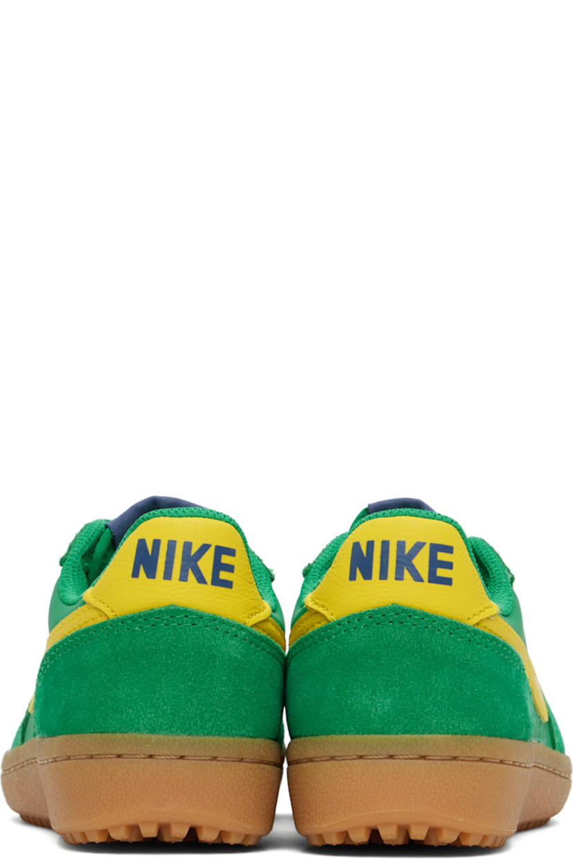 Low-top buffed leather and suede sneakers in green and yellow.

· Lace-up closure
· Logo patch at padded tongue
· Padded collar
· Swoosh appliqué at sides
· Logo printed at heel tab
· Foam rubber midsole
· Treaded rubber sole

Please note that this item may be shipped only within North America.

Supplier color: Stadium green/Sail/Diffused blue/Lightning