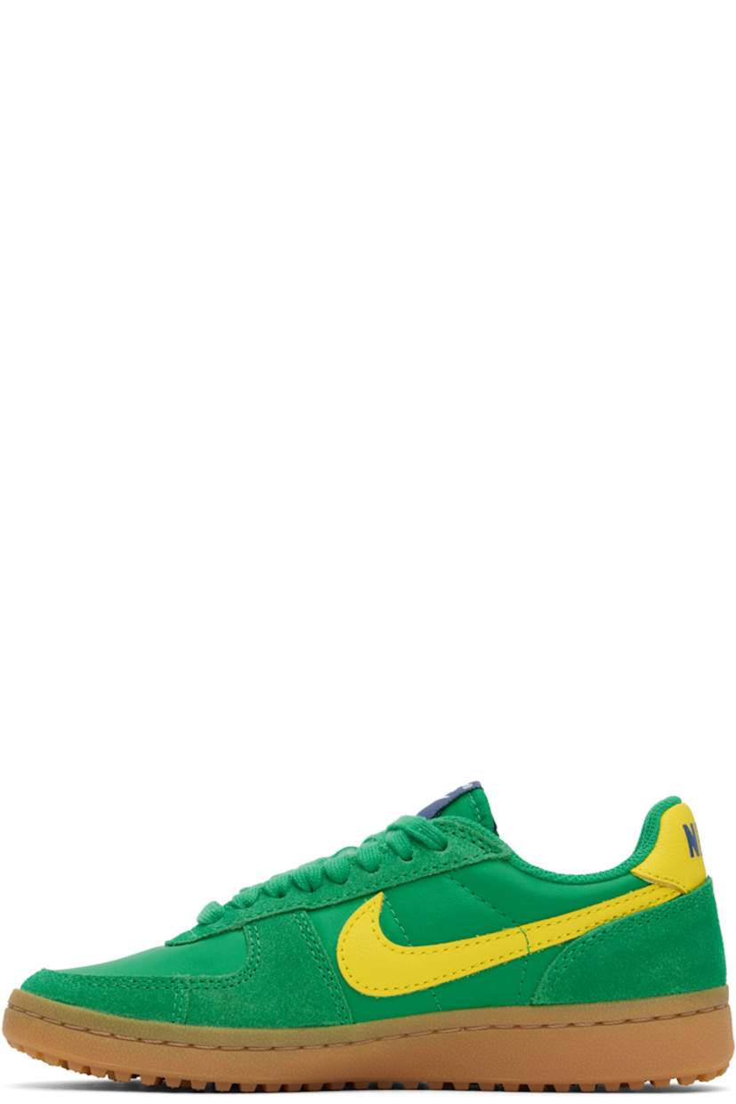Low-top buffed leather and suede sneakers in green and yellow.

· Lace-up closure
· Logo patch at padded tongue
· Padded collar
· Swoosh appliqué at sides
· Logo printed at heel tab
· Foam rubber midsole
· Treaded rubber sole

Please note that this item may be shipped only within North America.

Supplier color: Stadium green/Sail/Diffused blue/Lightning