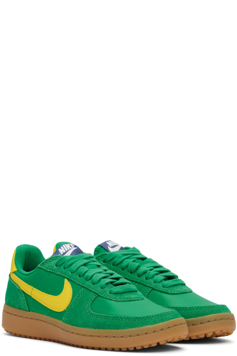 Low-top buffed leather and suede sneakers in green and yellow.

· Lace-up closure
· Logo patch at padded tongue
· Padded collar
· Swoosh appliqué at sides
· Logo printed at heel tab
· Foam rubber midsole
· Treaded rubber sole

Please note that this item may be shipped only within North America.

Supplier color: Stadium green/Sail/Diffused blue/Lightning
