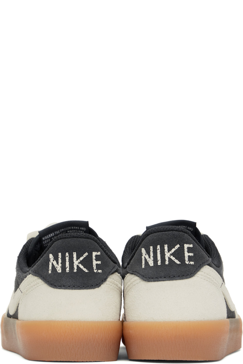 Low-top suede sneakers in gray and white.

· Ribbon lace-up closure
· Logo patch at padded tongue
· Padded collar
· Swoosh appliqué at sides
· Logo printed at heel tab
· Jersey lining
· Treaded gum rubber sole

Please note that this item may be shipped only within North America.

Supplier color: Off noir/Gum yellow/Sail