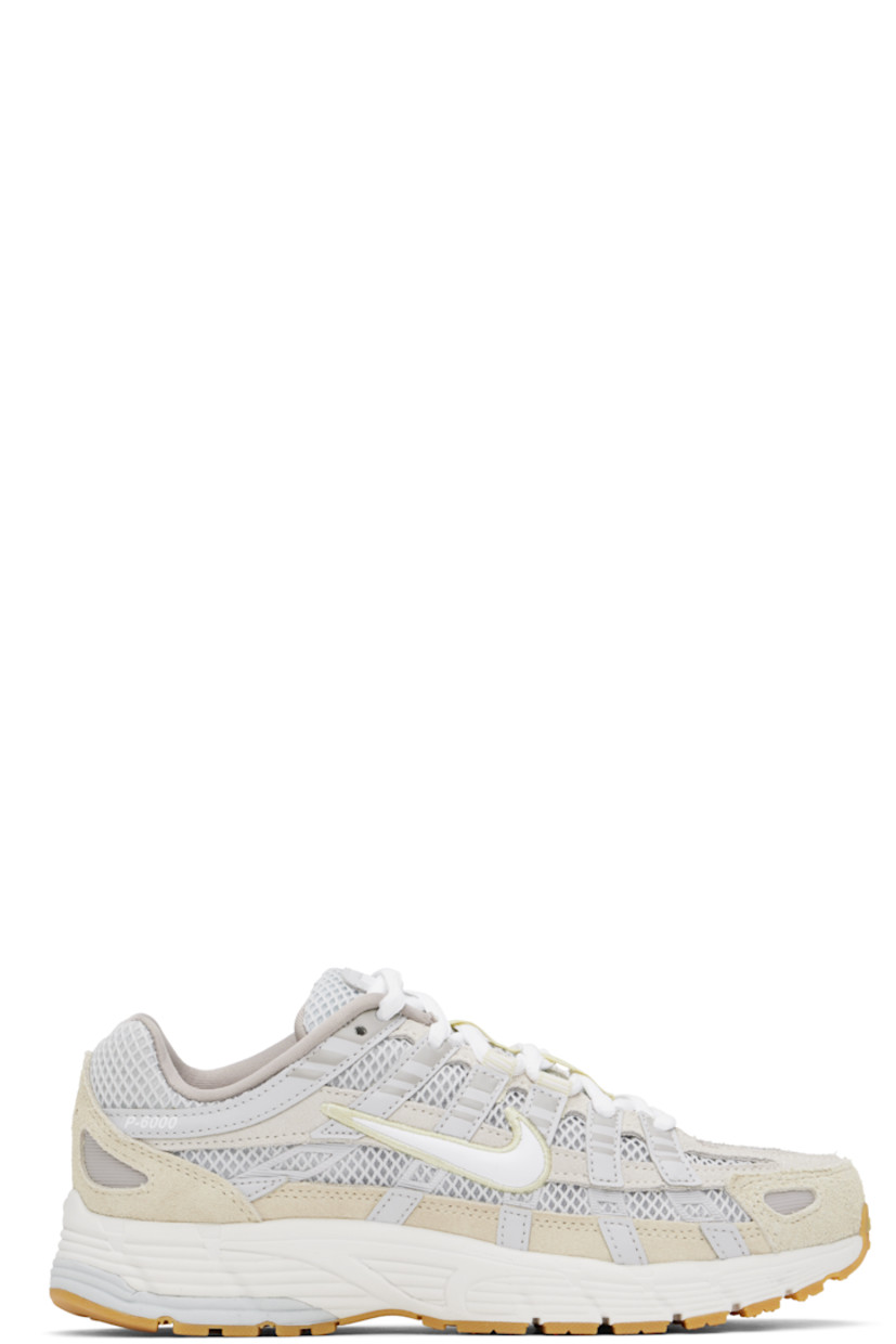 Low-top mesh and buffed leather sneakers in white and gray.

· Swoosh embroidered at toe
· Lace-up closure
· Logo patch at padded tongue
· Padded collar
· Faux-leather Swoosh appliqué at sides
· Text printed at outer side
· Mesh lining
· Foam rubber midsole
· Treaded rubber sole

Please note that this item may be shipped only within North America.

Supplier color: Photon dust/White