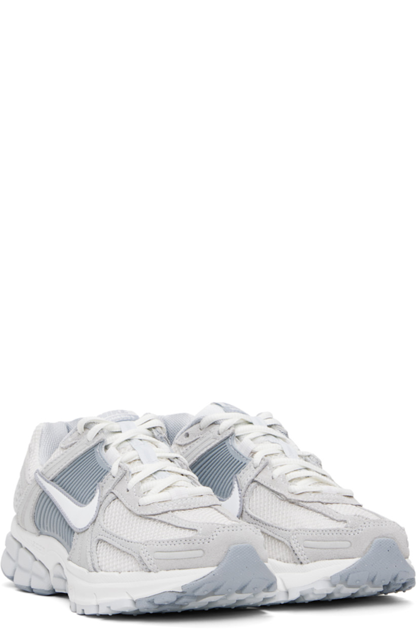 Low-top mesh, suede, and buffed faux-leather sneakers in white and gray.

· Reflective trim throughout
· Lace-up closure
· Logo patch at padded tongue
· Padded collar
· Rubberized overlay at sides and heel
· Swoosh appliqué at sides
· Swoosh printed at heel tab
· Mesh lining
· Zoom Air cushioning at foam rubber midsole
· Treaded rubber sole

Please note that this item may be shipped only within North America.

Supplier color: Pure platinum/Platinum tint/Wolf grey/Summit white
