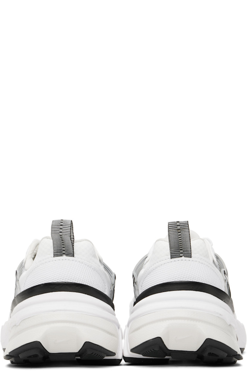 Low-top mesh and faux-leather sneakers in white.

· Swoosh printed at lace-up closure
· Logo patch at padded tongue
· Padded collar
· Swoosh and transparent rubber overlay at sides
· Reflective trim at outer side
· Reflective pull-loop at heel
· Cushlon foam rubber midsole
· Treaded rubber sole

Please note that this item may be shipped only within North America.

Supplier color: White/Platinum Tint/Summit White/White