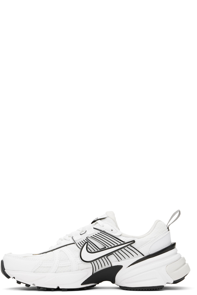 Low-top mesh and faux-leather sneakers in white.

· Swoosh printed at lace-up closure
· Logo patch at padded tongue
· Padded collar
· Swoosh and transparent rubber overlay at sides
· Reflective trim at outer side
· Reflective pull-loop at heel
· Cushlon foam rubber midsole
· Treaded rubber sole

Please note that this item may be shipped only within North America.

Supplier color: White/Platinum Tint/Summit White/White