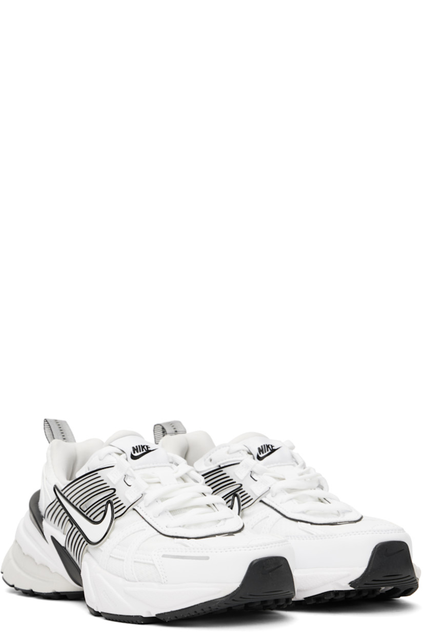 Low-top mesh and faux-leather sneakers in white.

· Swoosh printed at lace-up closure
· Logo patch at padded tongue
· Padded collar
· Swoosh and transparent rubber overlay at sides
· Reflective trim at outer side
· Reflective pull-loop at heel
· Cushlon foam rubber midsole
· Treaded rubber sole

Please note that this item may be shipped only within North America.

Supplier color: White/Platinum Tint/Summit White/White