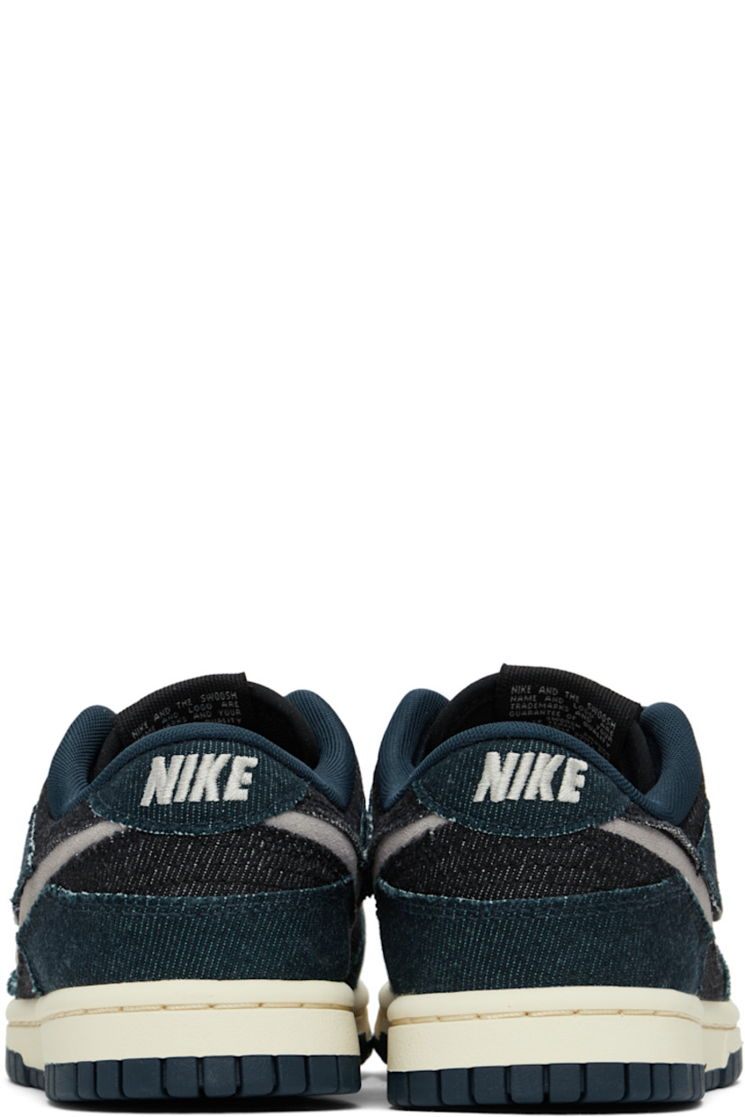 Low-top denim sneakers in navy and black.

· Lace-up closure
· Logo patch at padded tongue
· Padded collar
· Swoosh cutout at sides
· Logo embroidered at heel tab
· Mesh lining
· Treaded rubber sole

Please note that this item may be shipped only within North America.

Supplier color: Armory navy/College grey/ Black
