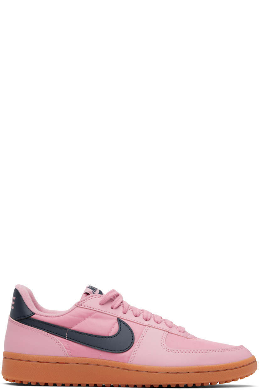 Low-top canvas and buffed faux-leather sneakers in pink.

· Lace-up closure
· Logo patch at padded tongue
· Padded collar
· Swoosh appliqué at sides
· Logo bonded at heel tab
· Jersey lining
· Cleated rubber sole

Please note that this item may be shipped only within North America.

Supplier color: Elemental pink/Gum medium brown/Obsidian