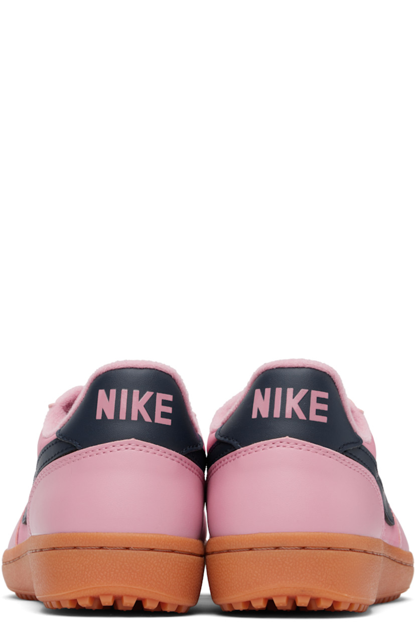 Low-top canvas and buffed faux-leather sneakers in pink.

· Lace-up closure
· Logo patch at padded tongue
· Padded collar
· Swoosh appliqué at sides
· Logo bonded at heel tab
· Jersey lining
· Cleated rubber sole

Please note that this item may be shipped only within North America.

Supplier color: Elemental pink/Gum medium brown/Obsidian