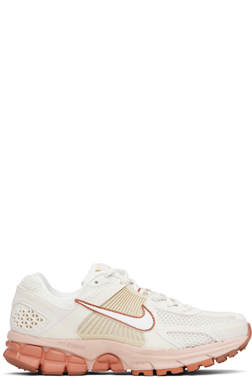 Low-top mesh and faux-leather sneakers in off-white and orange.

· Reflective trim throughout
· Lace-up closure
· Logo patch at padded tongue
· Padded collar
· Swoosh appliqué at sides
· Swoosh printed at heel
· Zoom Air unit at Cushlon foam rubber midsole
· Treaded rubber sole

Please note that this item may be shipped only within North America.

Supplier color: Phantom/Summit white