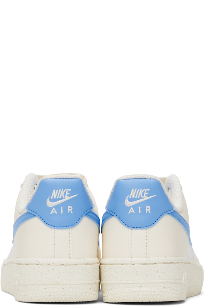 Low-top grained leather sneakers in off-white, blue, and white.

· Perforations throughout
· Logo plaque at lace-up closure
· Logo patch at padded tongue
· Padded collar
· Swoosh appliqué at sides
· Logo embroidered at heel tab
· Mesh lining
· Logo embossed at outer foam rubber midsole
· Treaded rubber sole

Please note that this item may be shipped only within North America.

Supplier color: Pale Ivory/White/Sail/University Blue