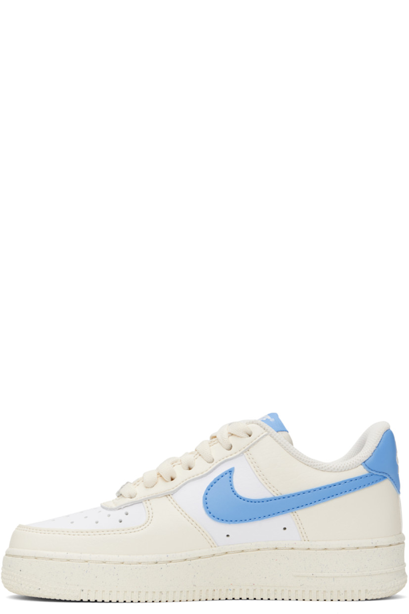 Low-top grained leather sneakers in off-white, blue, and white.

· Perforations throughout
· Logo plaque at lace-up closure
· Logo patch at padded tongue
· Padded collar
· Swoosh appliqué at sides
· Logo embroidered at heel tab
· Mesh lining
· Logo embossed at outer foam rubber midsole
· Treaded rubber sole

Please note that this item may be shipped only within North America.

Supplier color: Pale Ivory/White/Sail/University Blue