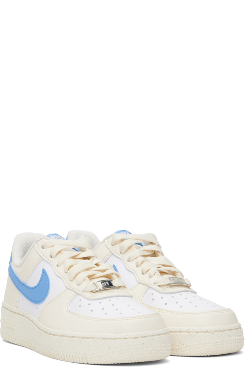Low-top grained leather sneakers in off-white, blue, and white.

· Perforations throughout
· Logo plaque at lace-up closure
· Logo patch at padded tongue
· Padded collar
· Swoosh appliqué at sides
· Logo embroidered at heel tab
· Mesh lining
· Logo embossed at outer foam rubber midsole
· Treaded rubber sole

Please note that this item may be shipped only within North America.

Supplier color: Pale Ivory/White/Sail/University Blue