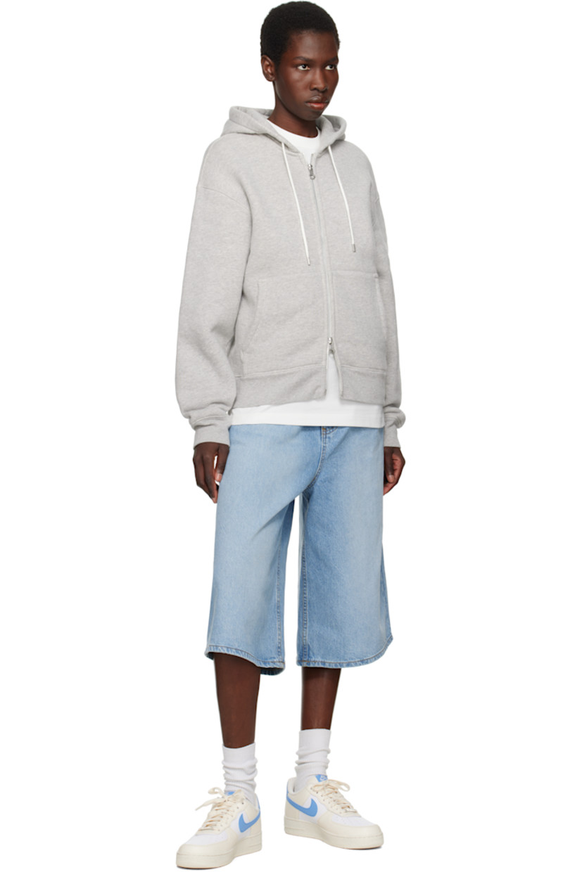 Low-top grained leather sneakers in off-white, blue, and white.

· Perforations throughout
· Logo plaque at lace-up closure
· Logo patch at padded tongue
· Padded collar
· Swoosh appliqué at sides
· Logo embroidered at heel tab
· Mesh lining
· Logo embossed at outer foam rubber midsole
· Treaded rubber sole

Please note that this item may be shipped only within North America.

Supplier color: Pale Ivory/White/Sail/University Blue