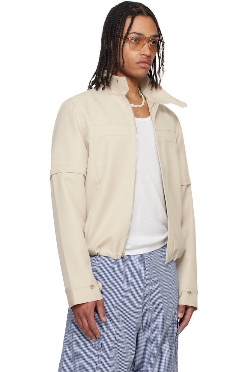 Polyester twill jacket. 

· Paneled construction
· Concealed button tab at stand collar
· Concealed zip closure
· Zip pockets
· Concealed bungee-style drawstring at hem 
· Detachable zip panel at sleeves
· Adjustable button tab at cuffs
· Zip pocket at interior
· Full mesh and plain-woven lining

Supplier color: Tan