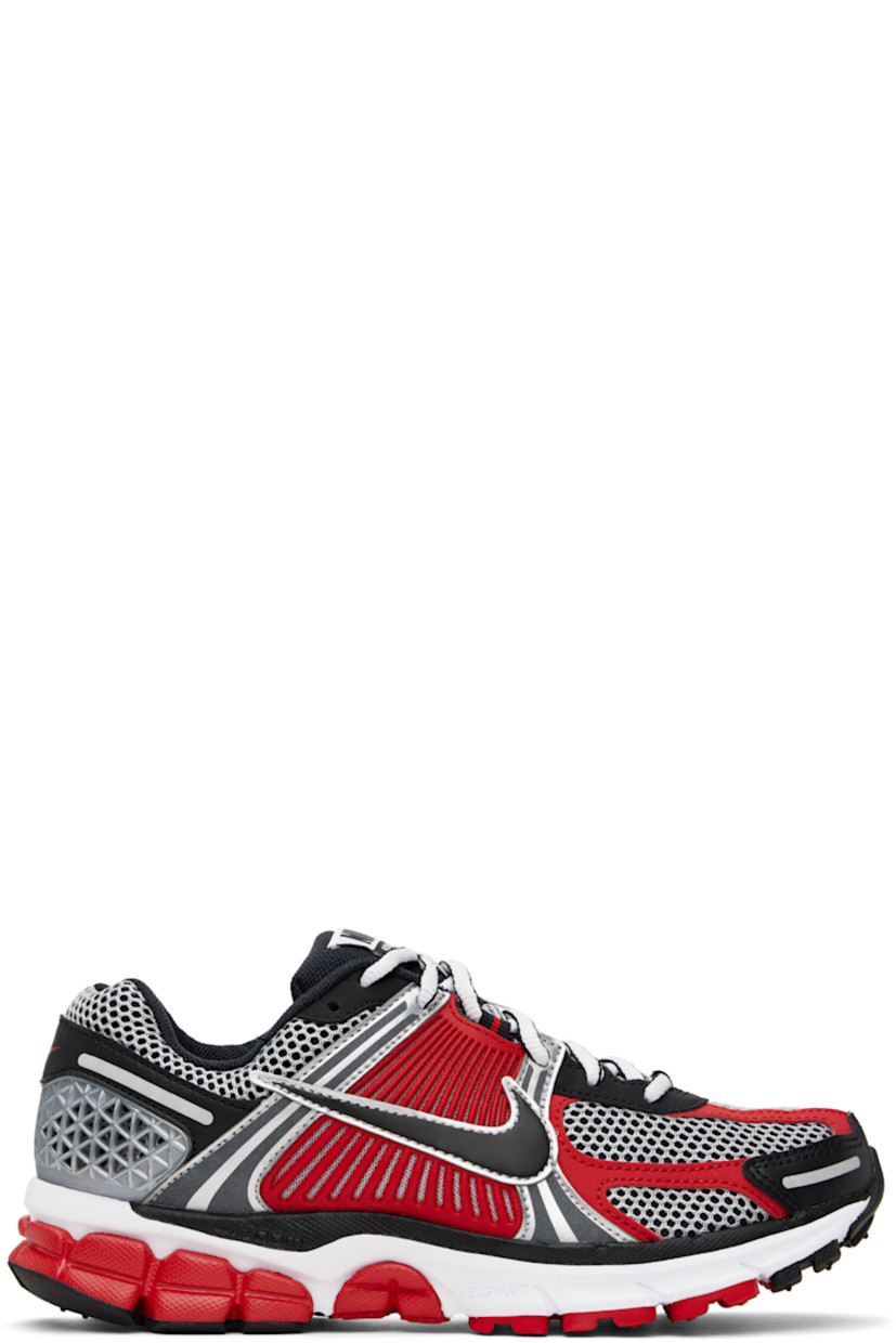 Low-top mesh and buffed faux-leather sneakers in silver tone and red.

· Reflective trim throughout
· Lace-up closure
· Logo patch at padded tongue
· Padded collar
· Rubberized overlay at sides and heel
· Swoosh appliqué at sides
· Swoosh printed at heel tab
· Mesh lining
· Zoom Air cushioning at foam rubber midsole
· Treaded rubber sole

Please note that this item may be shipped only within North America.

Supplier color: Metallic silver/University red/White/Black