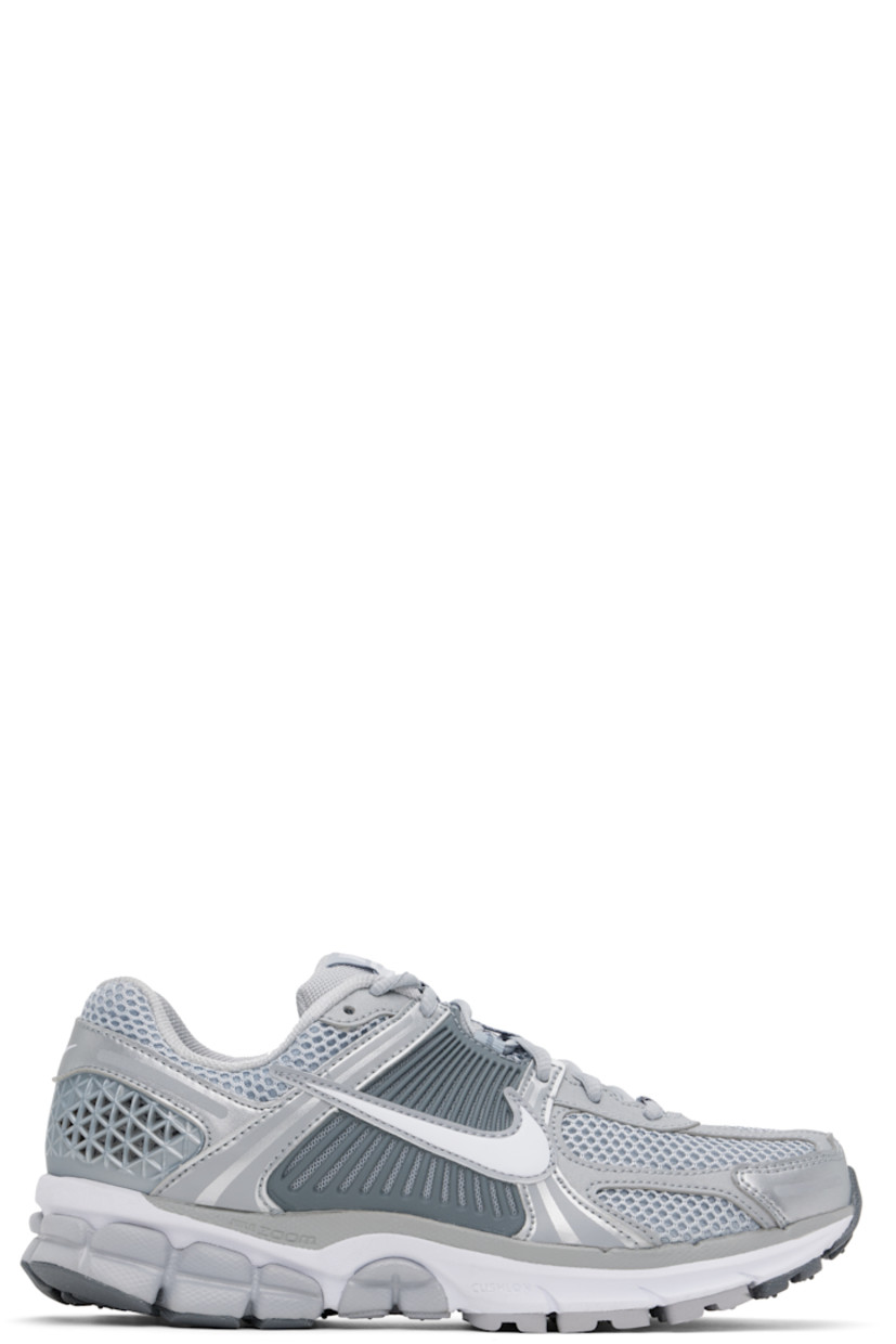 Low-top mesh and buffed faux-leather sneakers in silver tone.

· Reflective trim throughout
· Lace-up closure
· Logo patch at padded tongue
· Padded collar
· Rubberized overlay at sides and heel
· Swoosh appliqué at sides
· Swoosh printed at heel tab
· Mesh lining
· Zoom Air cushioning at foam rubber midsole
· Treaded rubber sole

Please note that this item may be shipped only within North America.

Supplier color: Wolf grey/White
