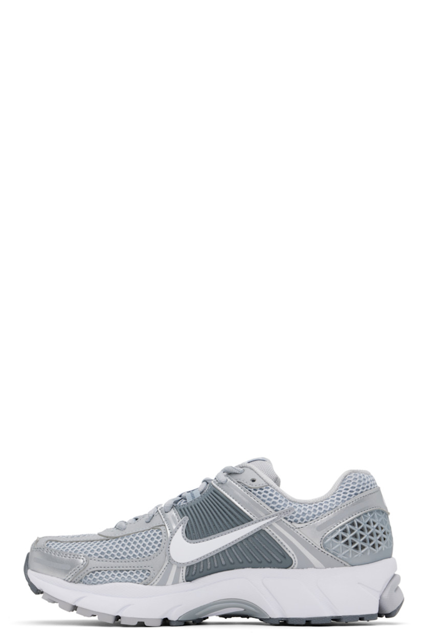 Low-top mesh and buffed faux-leather sneakers in silver tone.

· Reflective trim throughout
· Lace-up closure
· Logo patch at padded tongue
· Padded collar
· Rubberized overlay at sides and heel
· Swoosh appliqué at sides
· Swoosh printed at heel tab
· Mesh lining
· Zoom Air cushioning at foam rubber midsole
· Treaded rubber sole

Please note that this item may be shipped only within North America.

Supplier color: Wolf grey/White