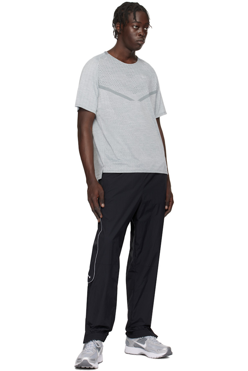 Low-top mesh and buffed faux-leather sneakers in silver tone.

· Reflective trim throughout
· Lace-up closure
· Logo patch at padded tongue
· Padded collar
· Rubberized overlay at sides and heel
· Swoosh appliqué at sides
· Swoosh printed at heel tab
· Mesh lining
· Zoom Air cushioning at foam rubber midsole
· Treaded rubber sole

Please note that this item may be shipped only within North America.

Supplier color: Wolf grey/White