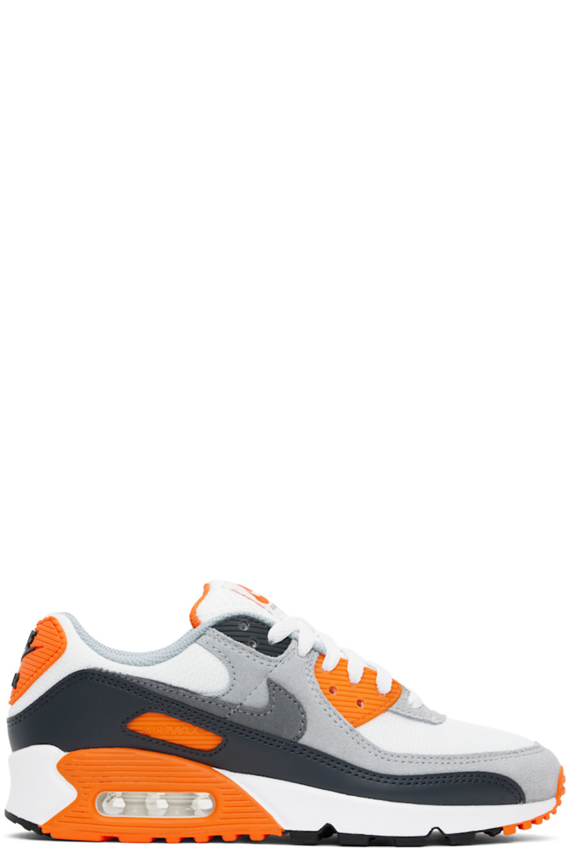 Low-top suede, buffed leather, and mesh sneakers in gray and white.

· Lace-up closure
· Logo patch at padded tongue
· Padded collar
· Rubberized trim at sides
· Swoosh appliqué 
· Rubberized logo patch at heel tab
· Air Max unit at foam rubber midsole
· Treaded rubber sole

Please note that this item may be shipped only within North America.

Supplier color: Summit white/Safety orange/Dark smoke grey/Smoke grey