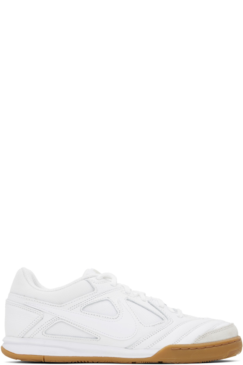 Low-top grained leather and canvas sneakers in white.

· Suede trim at toe
· Lace-up closure
· Logo patch at padded tongue
· Padded collar
· Swoosh appliqué at sides
· Mesh lining
· Treaded rubber sole

Please note that this item may be shipped only within North America.

Supplier color: White/Gum light brown/White