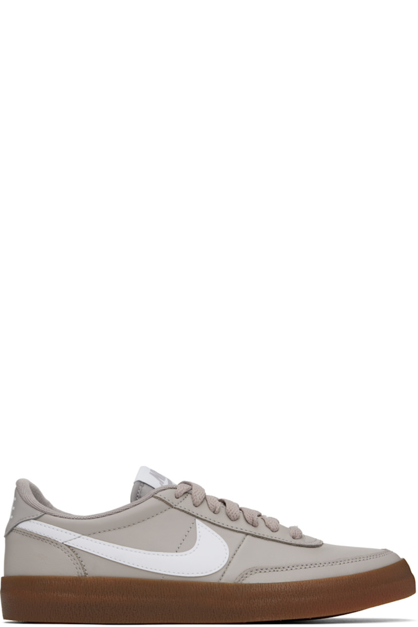 Low-top buffed leather sneakers in gray.

· Lace-up closure
· Logo patch at padded tongue
· Padded collar
· Swoosh appliqué at sides
· Logo printed at heel tab
· Mesh lining
· Treaded rubber sole

Please note that this item may be shipped only within North America.

Supplier color: College grey/Gum medium brown/White