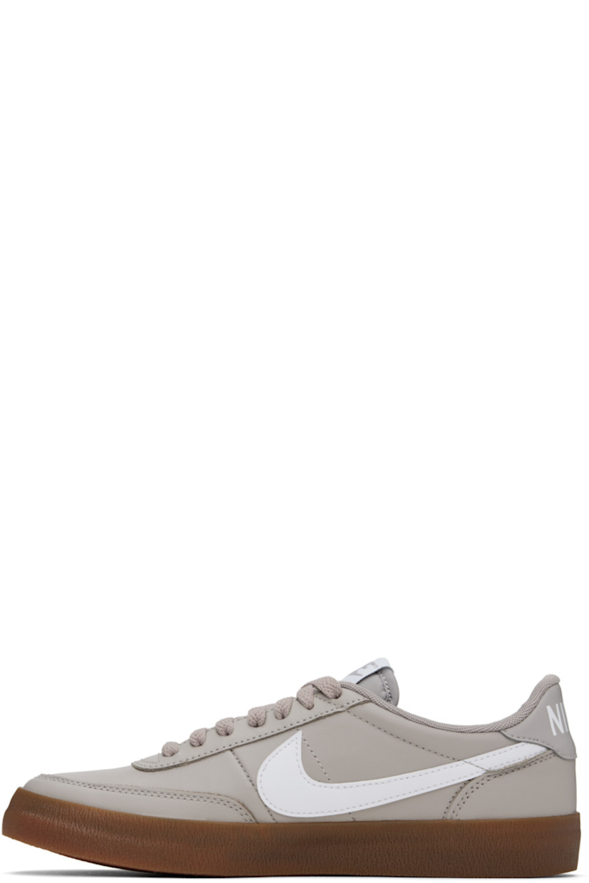 Low-top buffed leather sneakers in gray.

· Lace-up closure
· Logo patch at padded tongue
· Padded collar
· Swoosh appliqué at sides
· Logo printed at heel tab
· Mesh lining
· Treaded rubber sole

Please note that this item may be shipped only within North America.

Supplier color: College grey/Gum medium brown/White