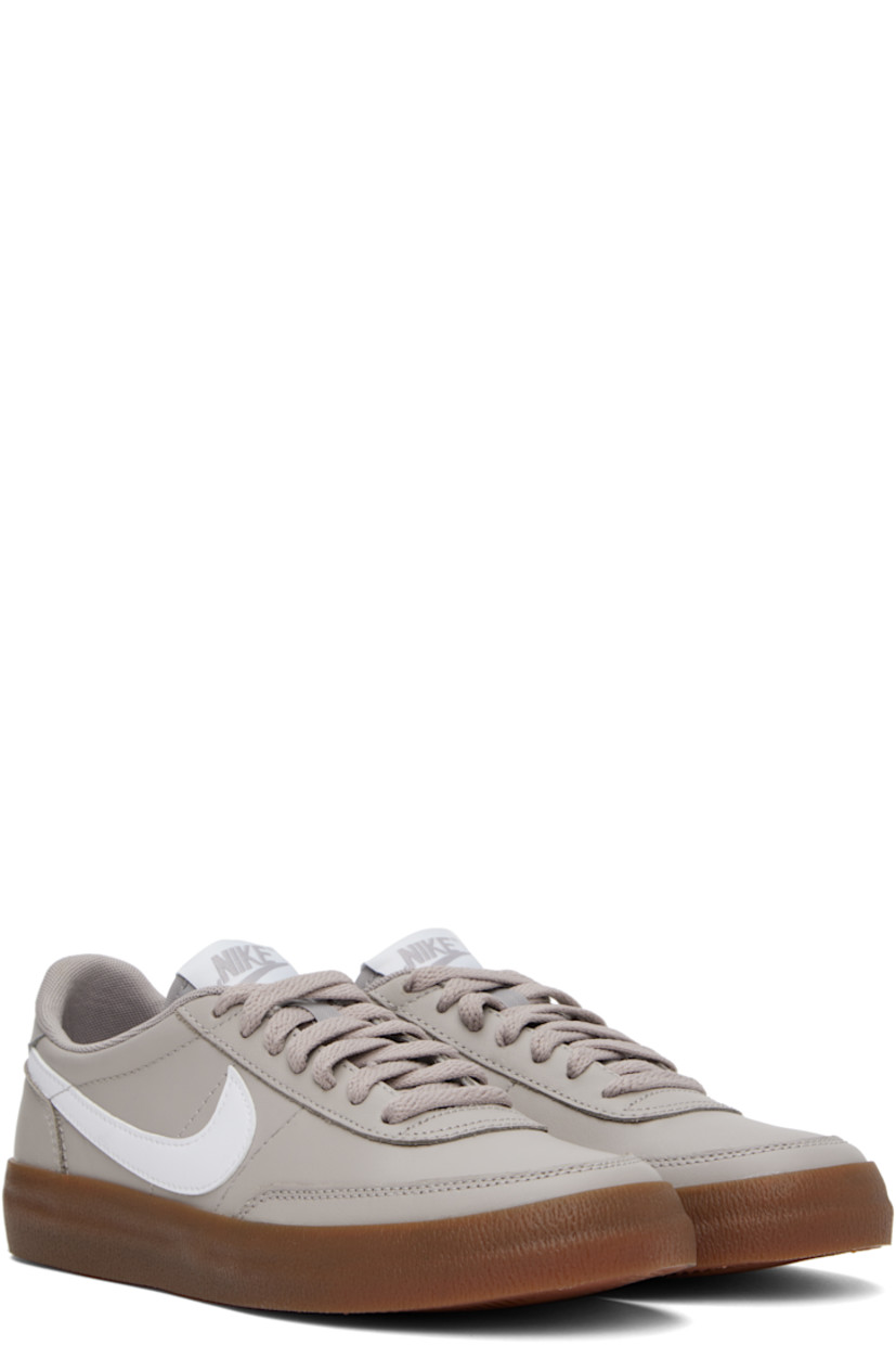 Low-top buffed leather sneakers in gray.

· Lace-up closure
· Logo patch at padded tongue
· Padded collar
· Swoosh appliqué at sides
· Logo printed at heel tab
· Mesh lining
· Treaded rubber sole

Please note that this item may be shipped only within North America.

Supplier color: College grey/Gum medium brown/White