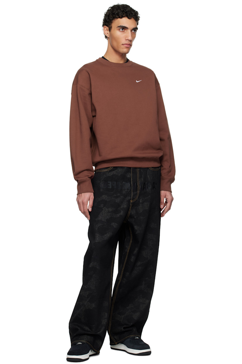 Low-top suede sneakers in black.

· Perforated detailing at toe
· Logo plaque at lace-up closure
· Logo patch at padded tongue
· Padded collar
· Swoosh embroidered at sides
· Logo embroidered at heel tab
· Jersey lining
· Treaded rubber sole

Please note that this item may be shipped only within North America.

Supplier color: Black/Sail