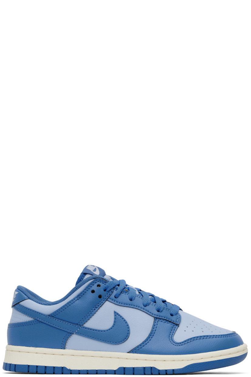 Low-top buffed leather and faux-leather sneakers in blue.

· Perforated detailing at toe
· Lace-up closure
· Logo patch at padded tongue
· Padded collar
· Swoosh appliqué at sides
· Logo embroidered at heel tab
· Mesh lining
· Treaded rubber sole

Please note that this item may be shipped only within North America.

Supplier color: Psychic blue/Star blue/Sail