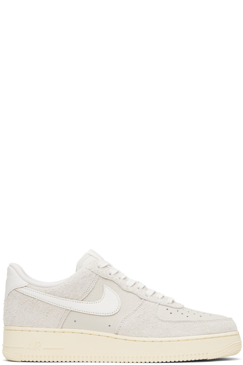 Low-top grained leather and suede sneakers in off-white.

· Perforations throughout
· Logo plaque at lace-up closure
· Logo patch at padded tongue
· Padded collar
· Swoosh appliqué at sides
· Logo embossed at heel tab
· Mesh lining
· Logo embossed at outer midsole
· Treaded rubber sole

Please note that this item may be shipped only within North America.

Supplier color: Phantom/Summit white