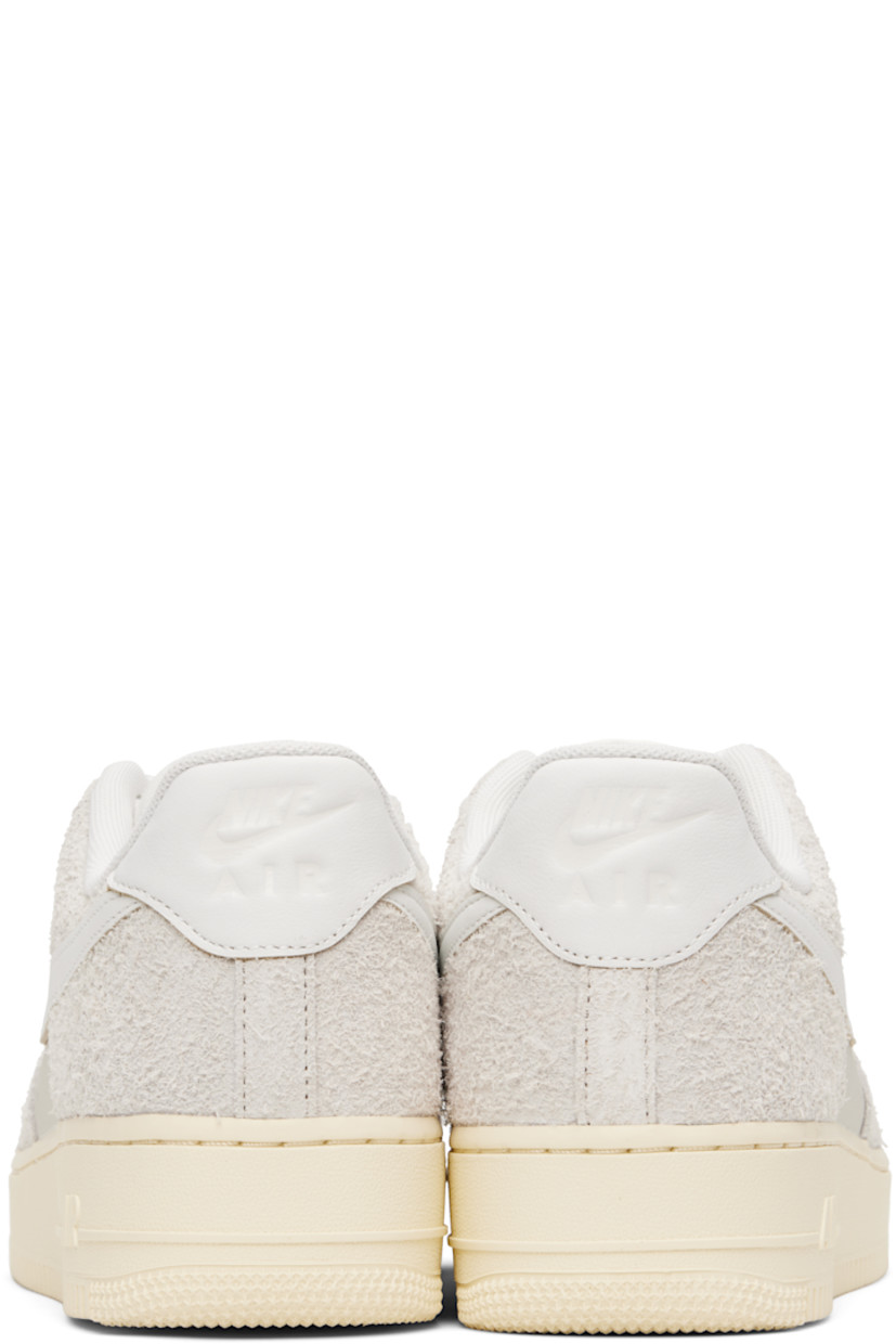 Low-top grained leather and suede sneakers in off-white.

· Perforations throughout
· Logo plaque at lace-up closure
· Logo patch at padded tongue
· Padded collar
· Swoosh appliqué at sides
· Logo embossed at heel tab
· Mesh lining
· Logo embossed at outer midsole
· Treaded rubber sole

Please note that this item may be shipped only within North America.

Supplier color: Phantom/Summit white