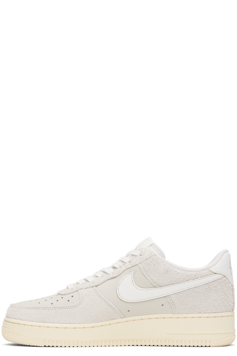 Low-top grained leather and suede sneakers in off-white.

· Perforations throughout
· Logo plaque at lace-up closure
· Logo patch at padded tongue
· Padded collar
· Swoosh appliqué at sides
· Logo embossed at heel tab
· Mesh lining
· Logo embossed at outer midsole
· Treaded rubber sole

Please note that this item may be shipped only within North America.

Supplier color: Phantom/Summit white