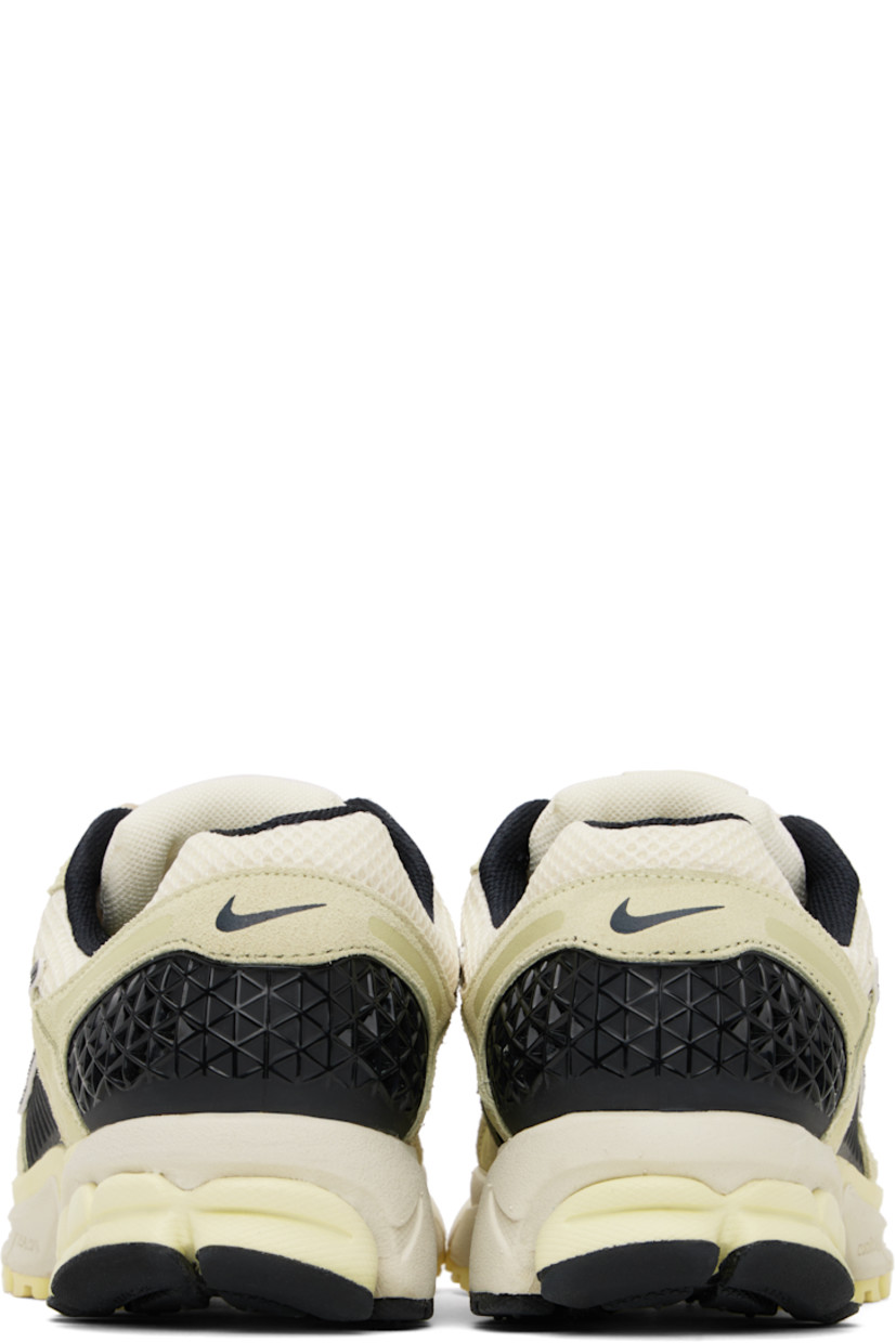 Low-top mesh, suede, and buffed faux-leather sneakers in off-white and black.

· Lace-up closure
· Logo patch at padded tongue
· Padded collar
· Rubberized overlay at sides and heel
· Swoosh appliqué at sides
· Swoosh printed at heel
· Mesh lining
· Zoom Air unit at foam rubber midsole
· Treaded rubber sole 

Please note that this item may be shipped only within North America.

Supplier color: Alabaster/Black/White/Pale ivory