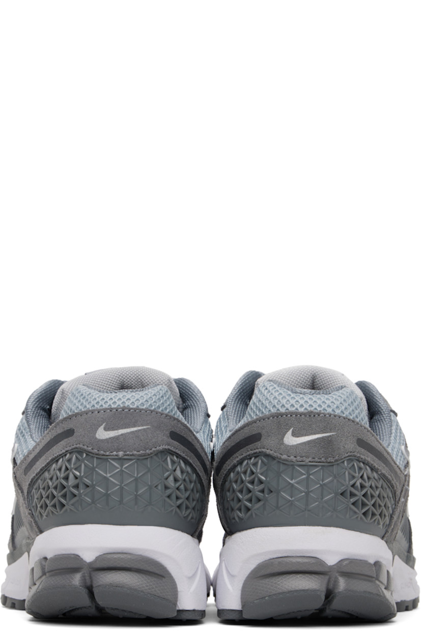 Low-top mesh, suede, and buffed faux-leather sneakers in gray.

· Reflective trim throughout
· Lace-up closure
· Logo patch at padded tongue
· Padded collar
· Rubberized overlay at sides and heel
· Swoosh appliqué at sides
· Swoosh printed at heel
· Mesh lining
· Zoom Air unit at foam rubber midsole
· Treaded rubber sole 

Please note that this item may be shipped only within North America.

Supplier color: Cool Grey/Wolf Grey/White