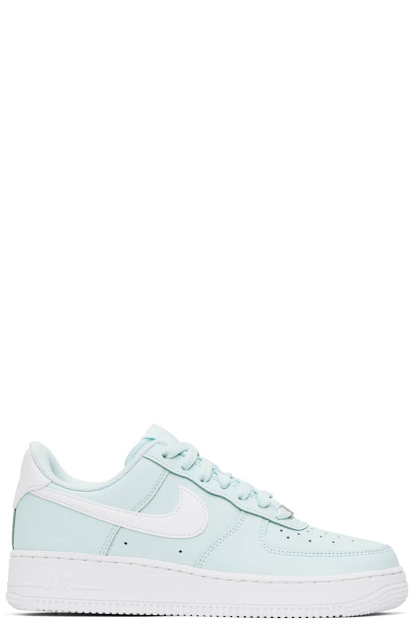Low-top buffed leather sneakers in blue.

· Perforations at toe and sides
· Logo plaque at lace-up closure
· Logo flag at padded tongue
· Padded collar
· Swoosh appliqué at sides
· Logo embroidered at heel tab
· Mesh lining
· Air Sole unit at midsole
· Treaded rubber sole

Please note that this item may be shipped only within North America.

Supplier color: Glacier blue/White