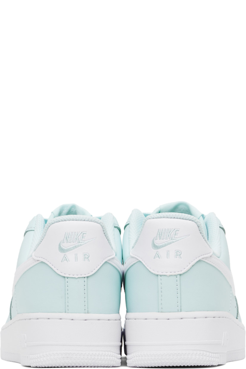 Low-top buffed leather sneakers in blue.

· Perforations at toe and sides
· Logo plaque at lace-up closure
· Logo flag at padded tongue
· Padded collar
· Swoosh appliqué at sides
· Logo embroidered at heel tab
· Mesh lining
· Air Sole unit at midsole
· Treaded rubber sole

Please note that this item may be shipped only within North America.

Supplier color: Glacier blue/White