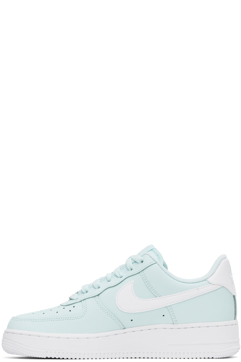 Low-top buffed leather sneakers in blue.

· Perforations at toe and sides
· Logo plaque at lace-up closure
· Logo flag at padded tongue
· Padded collar
· Swoosh appliqué at sides
· Logo embroidered at heel tab
· Mesh lining
· Air Sole unit at midsole
· Treaded rubber sole

Please note that this item may be shipped only within North America.

Supplier color: Glacier blue/White