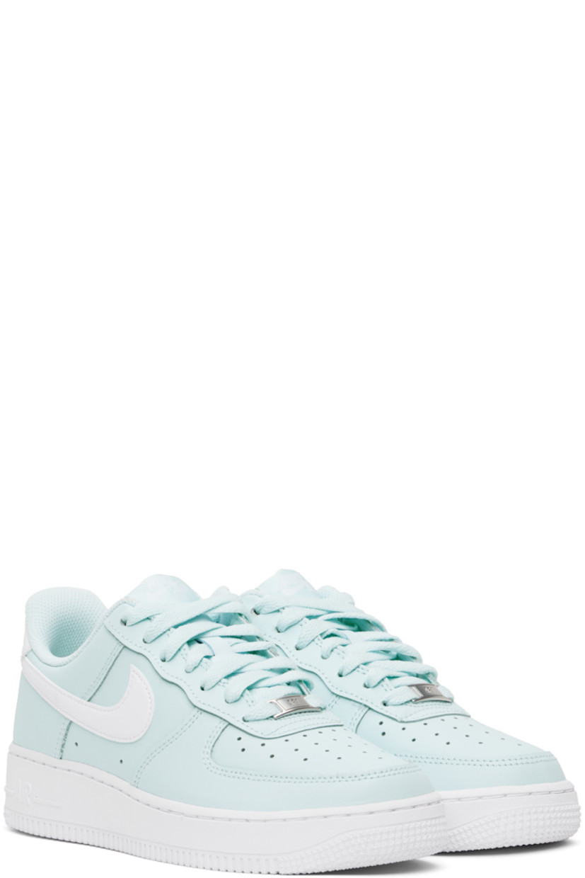 Low-top buffed leather sneakers in blue.

· Perforations at toe and sides
· Logo plaque at lace-up closure
· Logo flag at padded tongue
· Padded collar
· Swoosh appliqué at sides
· Logo embroidered at heel tab
· Mesh lining
· Air Sole unit at midsole
· Treaded rubber sole

Please note that this item may be shipped only within North America.

Supplier color: Glacier blue/White