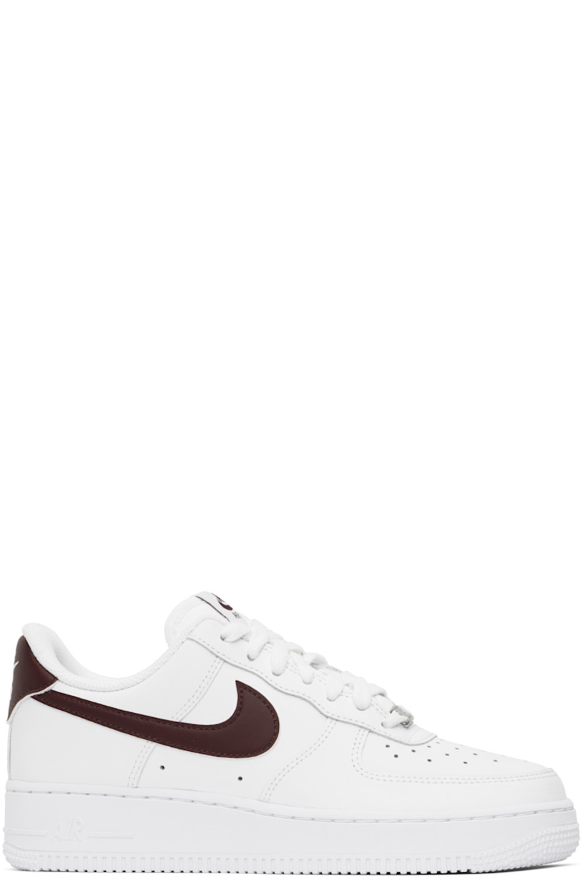 Low-top buffed leather sneakers in white.

· Perforations at toe and sides
· Logo plaque at lace-up closure
· Logo flag at padded tongue
· Padded collar
· Swoosh appliqué at sides
· Logo embroidered at heel tab
· Mesh lining
· Air Sole unit at midsole
· Treaded rubber sole

Please note that this item may be shipped only within North America.

Supplier color: White/White/Burgundy crush