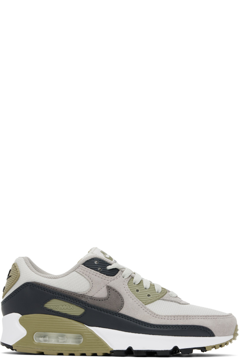 Low-top suede and mesh sneakers in gray and khaki.

· Lace-up closure
· Logo patch at padded tongue
· Padded collar
· Swoosh appliqué and rubberized trim at sides
· Rubberized logo patch at heel
· Air Max unit at foam rubber midsole
· Treaded rubber sole

Please note that this item may be shipped only within North America.

Supplier color: Light bone/Neutral olive/College grey/Cave stone