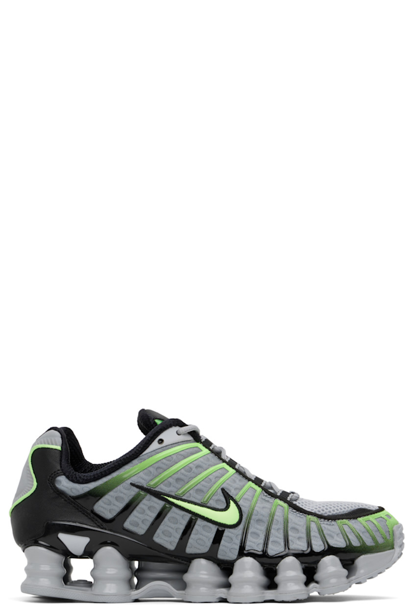 Low-top mesh sneakers in gray and green.

· Bonded rubber trim throughout
· Lace-up closure
· Logo bonded at padded tongue
· Inset patch at tongue and heel
· Padded collar
· Swoosh appliqué at sides
· Mesh lining
· Nike Shox units at midsole
· Treaded rubber sole

Please note that this item may be shipped only within North America.

Supplier color: Wolf grey/Lime blast/Black