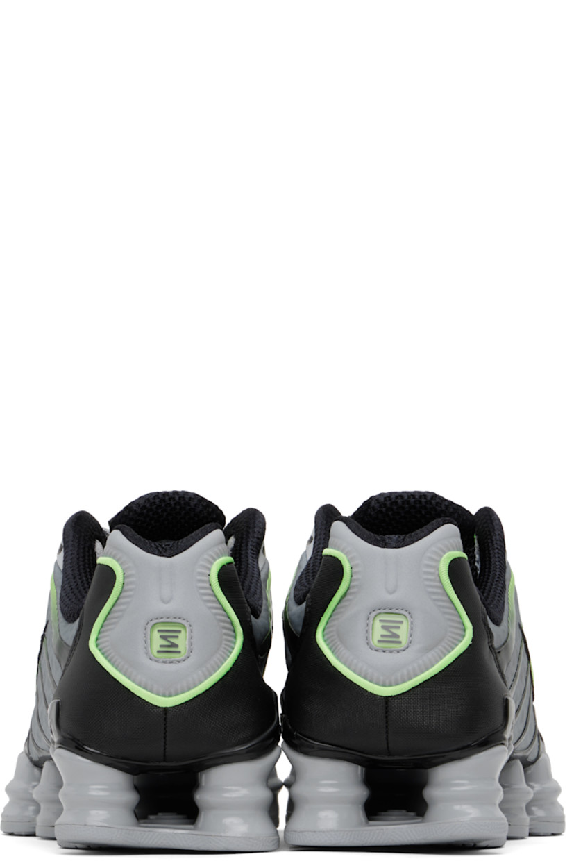 Low-top mesh sneakers in gray and green.

· Bonded rubber trim throughout
· Lace-up closure
· Logo bonded at padded tongue
· Inset patch at tongue and heel
· Padded collar
· Swoosh appliqué at sides
· Mesh lining
· Nike Shox units at midsole
· Treaded rubber sole

Please note that this item may be shipped only within North America.

Supplier color: Wolf grey/Lime blast/Black