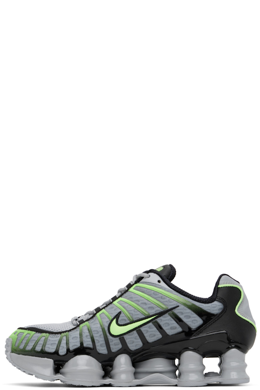 Low-top mesh sneakers in gray and green.

· Bonded rubber trim throughout
· Lace-up closure
· Logo bonded at padded tongue
· Inset patch at tongue and heel
· Padded collar
· Swoosh appliqué at sides
· Mesh lining
· Nike Shox units at midsole
· Treaded rubber sole

Please note that this item may be shipped only within North America.

Supplier color: Wolf grey/Lime blast/Black