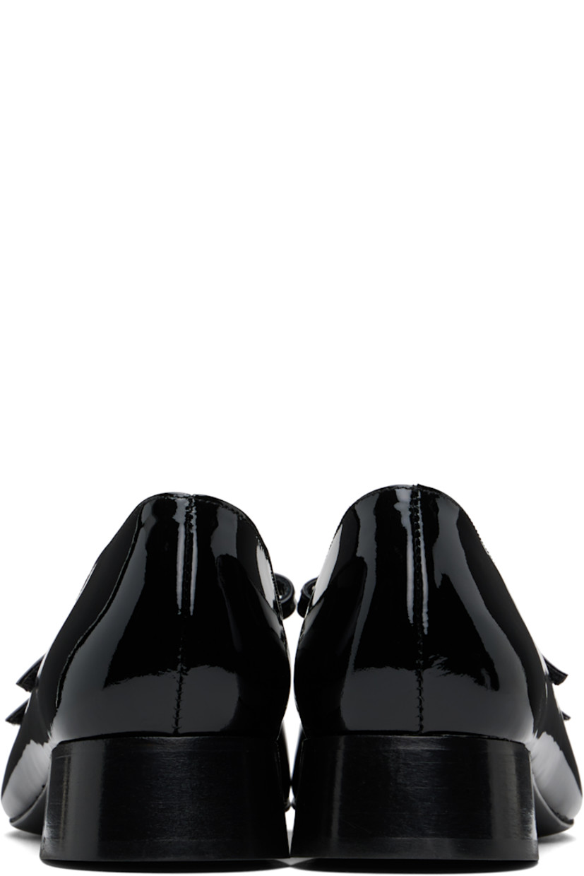 Handcrafted patent leather Mary Jane-style ballerina flats in black.

· Square toe
· Velcro straps at vamp
· Buffed leather and suede lining
· Stacked block heel with rubber injection
· Leather sole
· Heel: H1.25"

Supplier color: Black