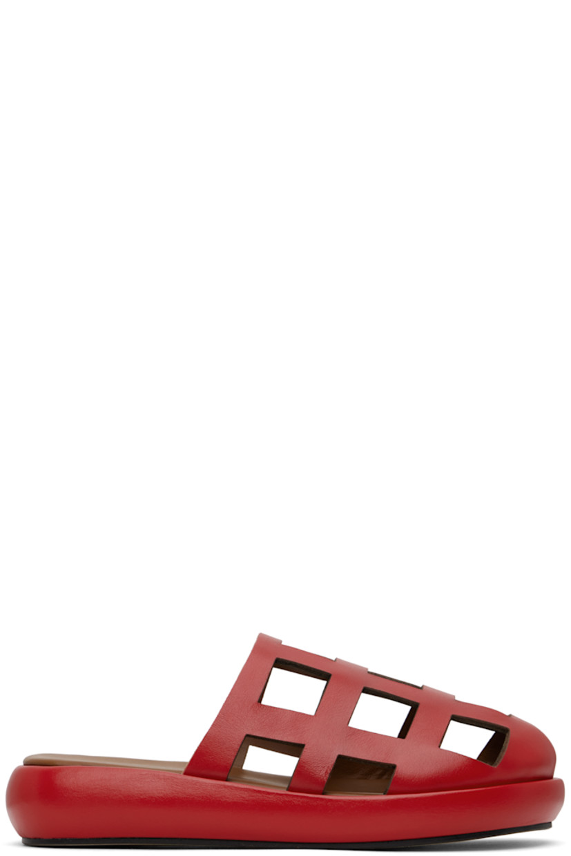 Handcrafted buffed leather slippers in red.

· Cutouts throughout
· Logo printed at padded leather footbed
· Grained leather lining
· Covered midsole
· Suede sole

Supplier color: Red